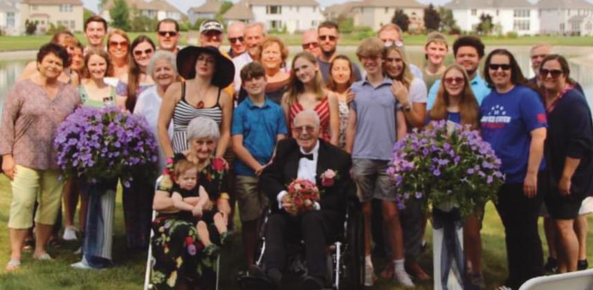 Dorothy and Al Stanton, front, with their family, which includes three daughters, nine grandchildren and 14 great-grandchildren. A son and a daughter died five years ago and a few months ago, respectively. “It took a village to put our anniversary wedding together,” Mrs. Stanton said. “We are very fortunate.”