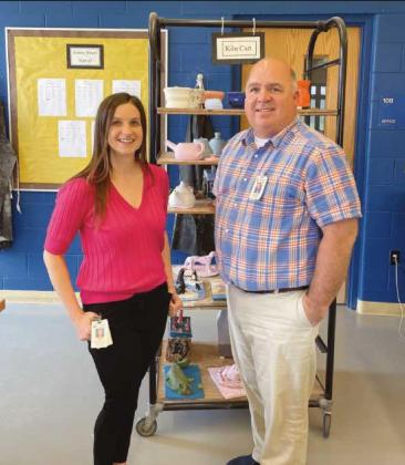 Meghan Yarnell and Don Griffith in front of the kiln cart.